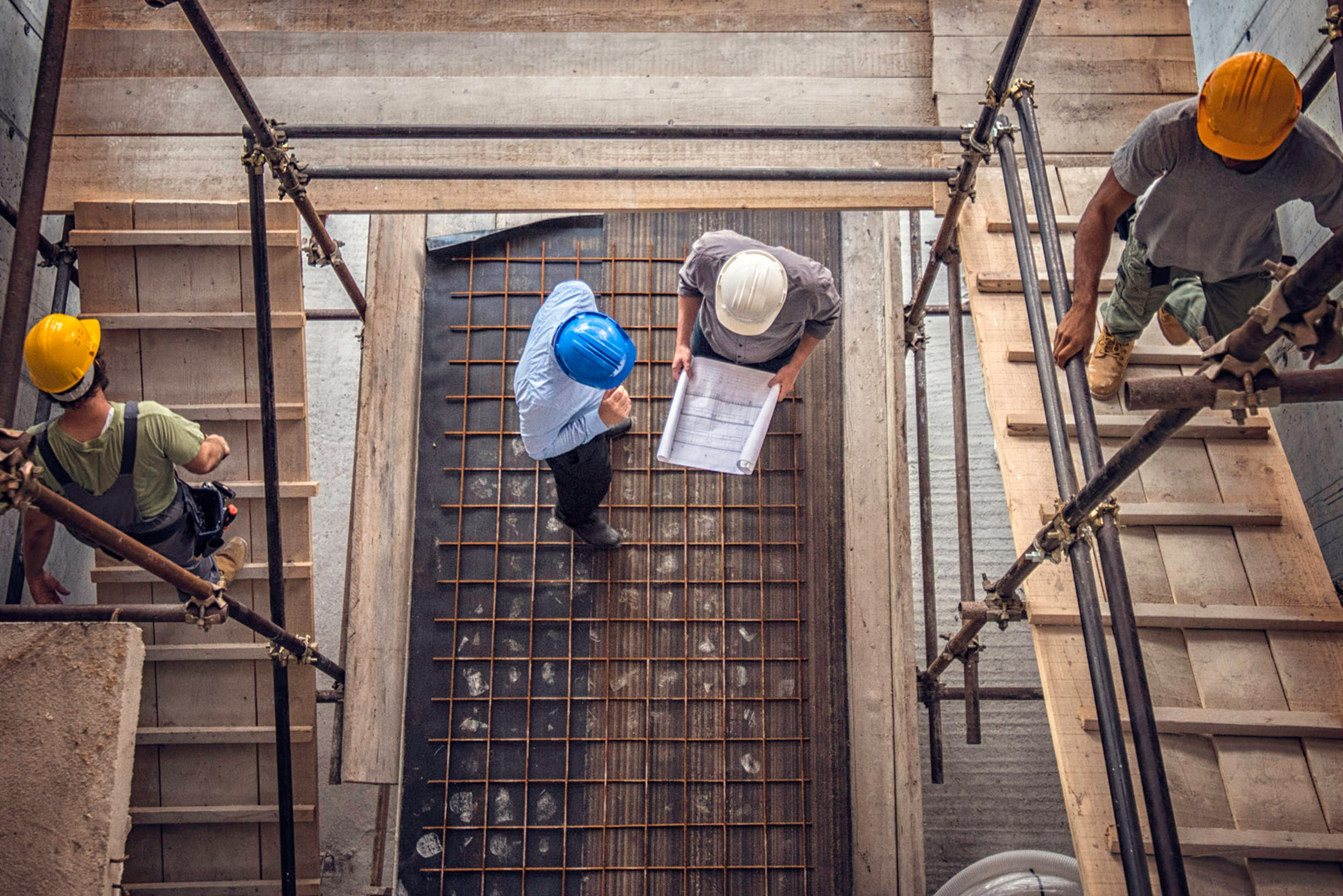 Engineer surveyor working with theodolite at construction site